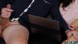 Performer lying on a padded table in a dim studio room