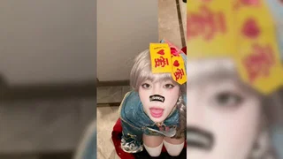 Asian performers in a hotel room scene filmed close up