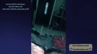 Couple filming themselves in an apartment bedroom
